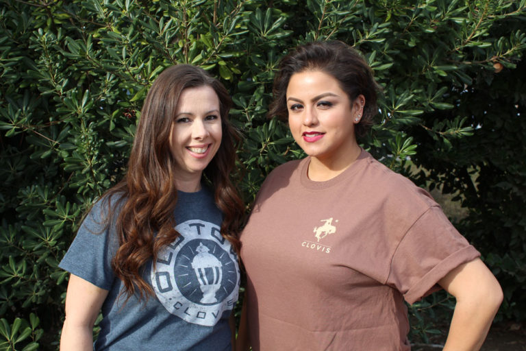 An image of two women wearing Clovis shirts