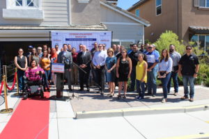 Image of group of De Young employees, City of Clovis Mayor Drew Bessinger, and residents