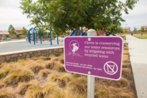 sign notifying residents of purple pipes transporting recycled water