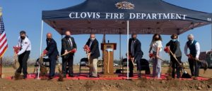 groundbreaking ceremony for Station 6, shows 8 individuals shoveling dirt.