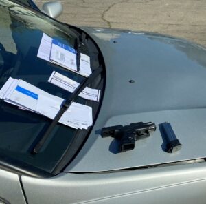 Photo of stolen vehicle, gun, and mail