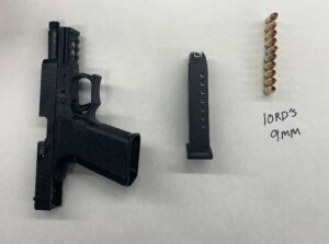 Photo of illegal handgun, magazine, and ammo.