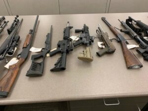 Close up photo of several firearms seized.