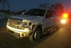 Suspect's truck with damage to the front of it from 3 collisions.