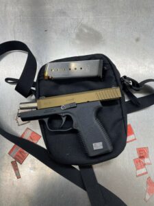 Handgun seized from suspect.