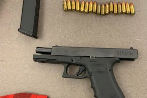 Photo of firearm located by suspects, with magazine and ammo.